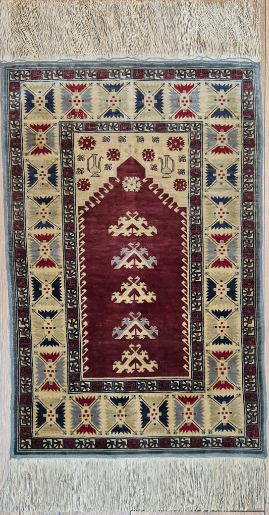 Hereke Seidenteppich Gebetsteppich geometrisches Design fein handgeknüpft