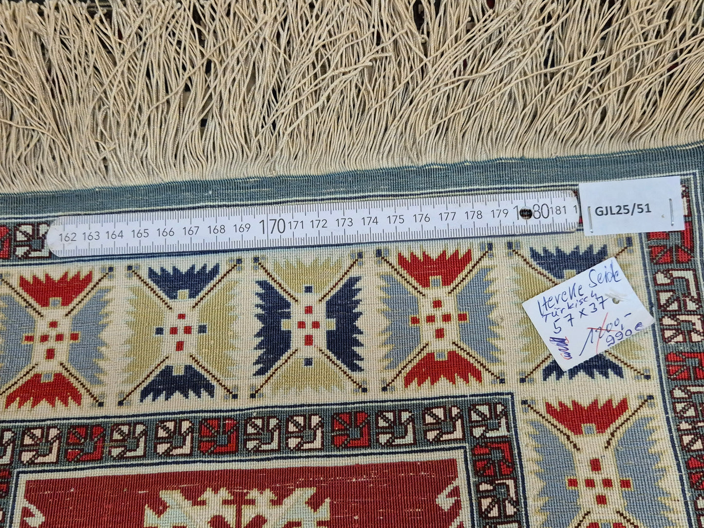 Hereke Seidenteppich Gebetsteppich geometrisches Design fein handgeknüpft