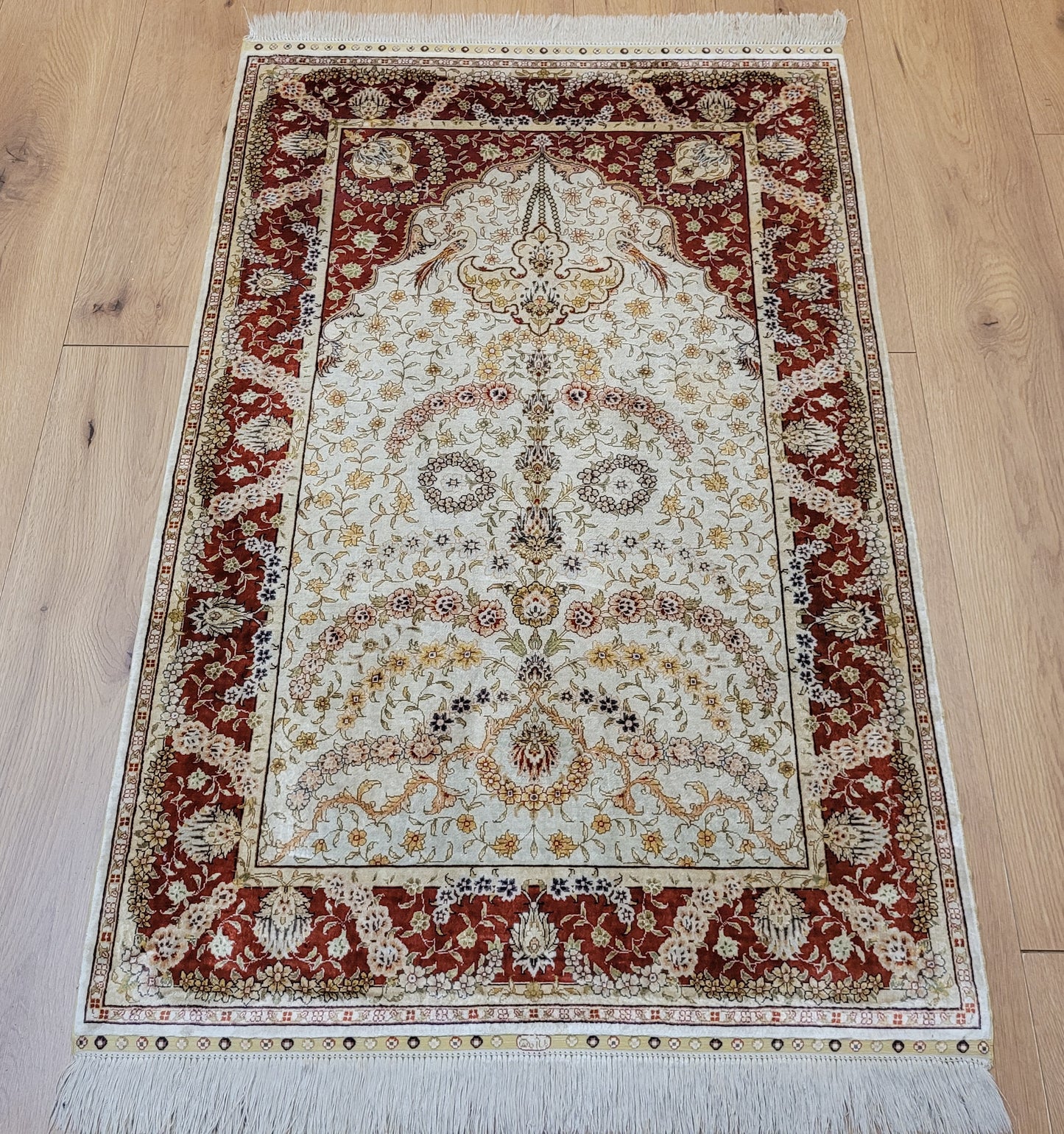 Hereke Teppich Seide auf Seide signiert fein Paradiesvogel Motiv