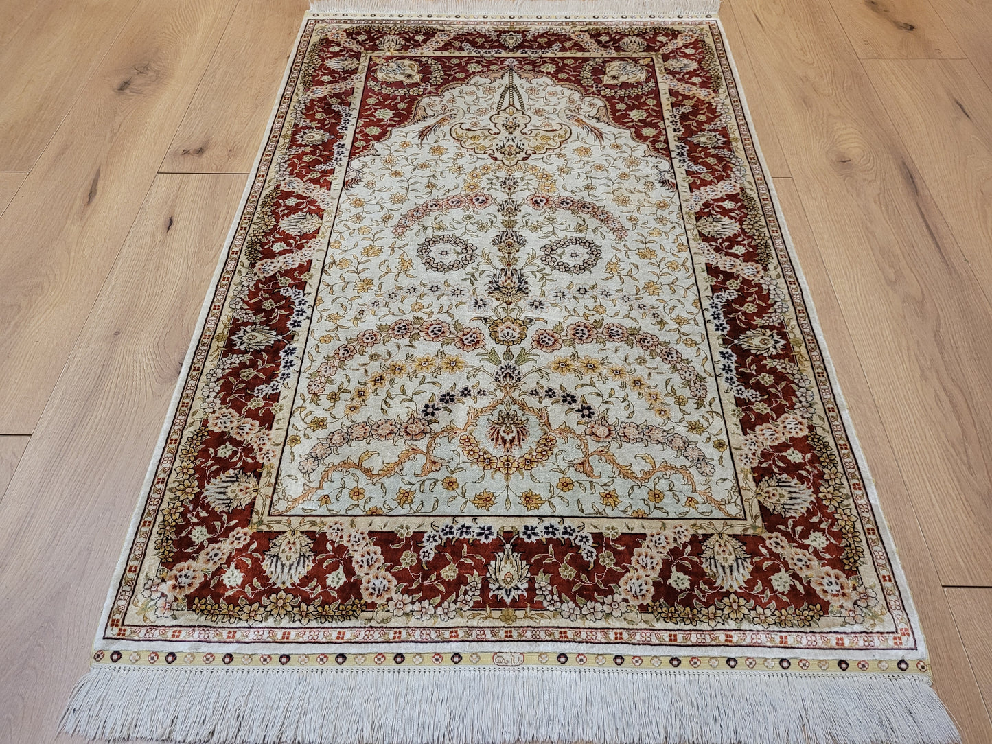 Hereke Teppich Seide auf Seide signiert fein Paradiesvogel Motiv