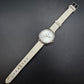 Elegante Damen Uhr mit Strassbesatz und weißem Armband