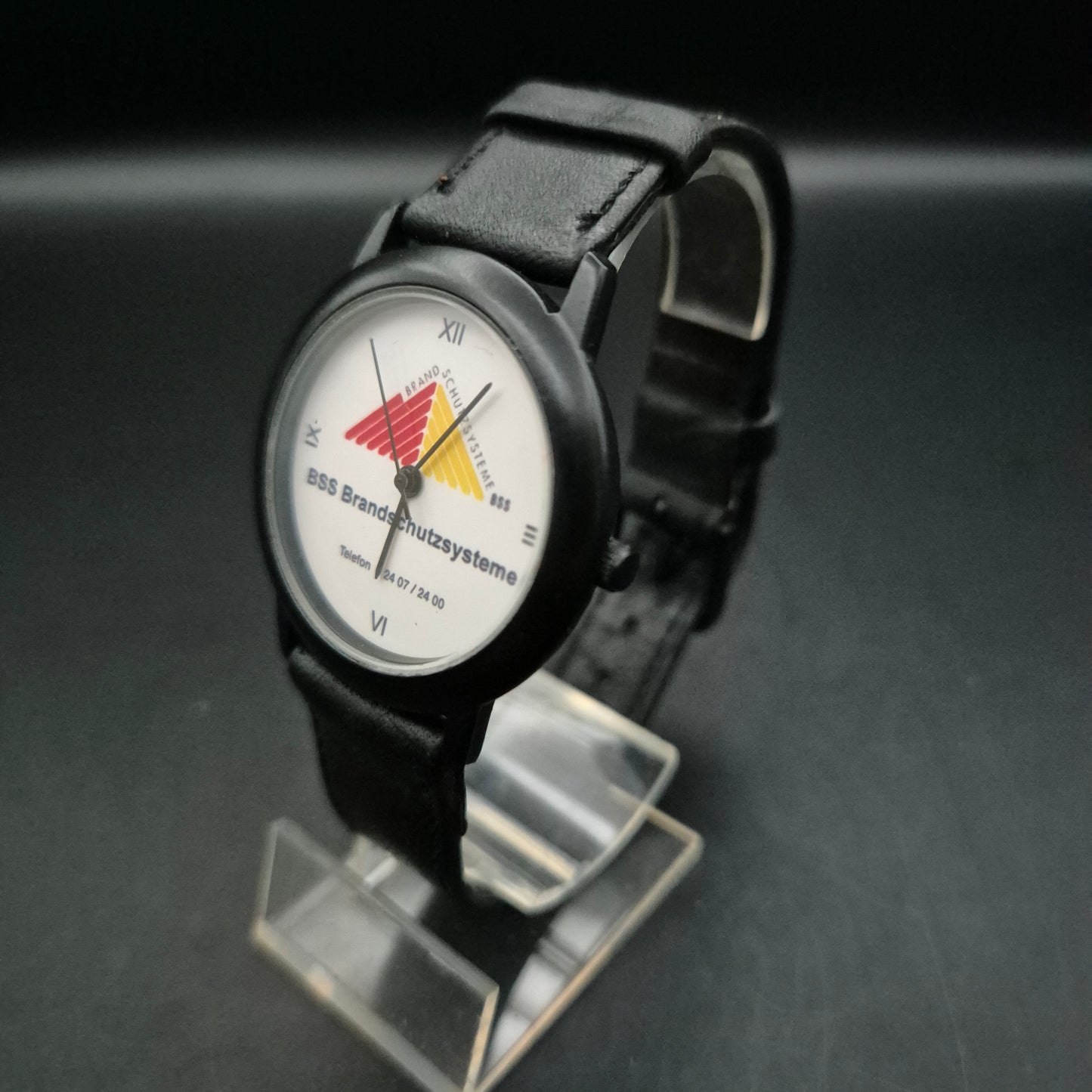 BSS Brandschutzsysteme Werbeuhr – Schwarze Quarzuhr mit Firmenlogo