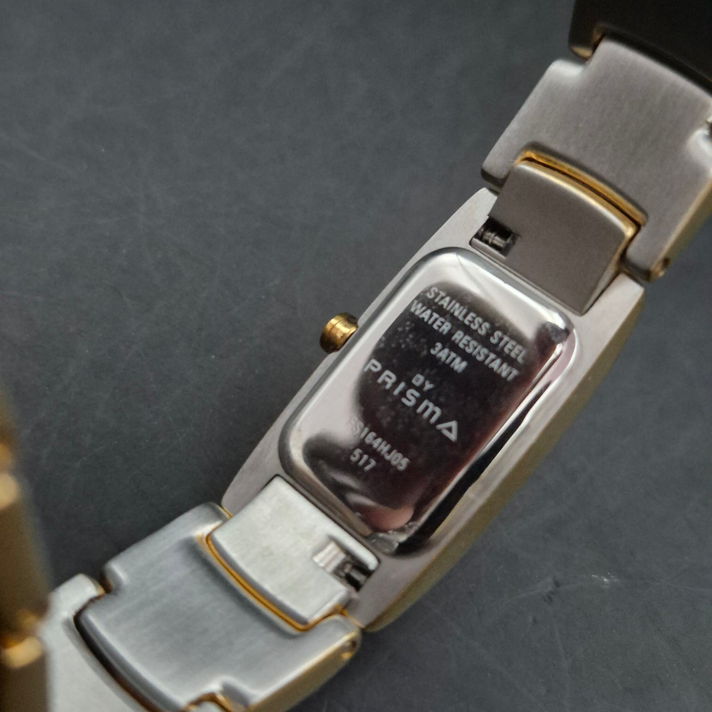 Prisma Damen Uhr – Zweifarbige Edelstahl Uhr mit goldenen Akzenten