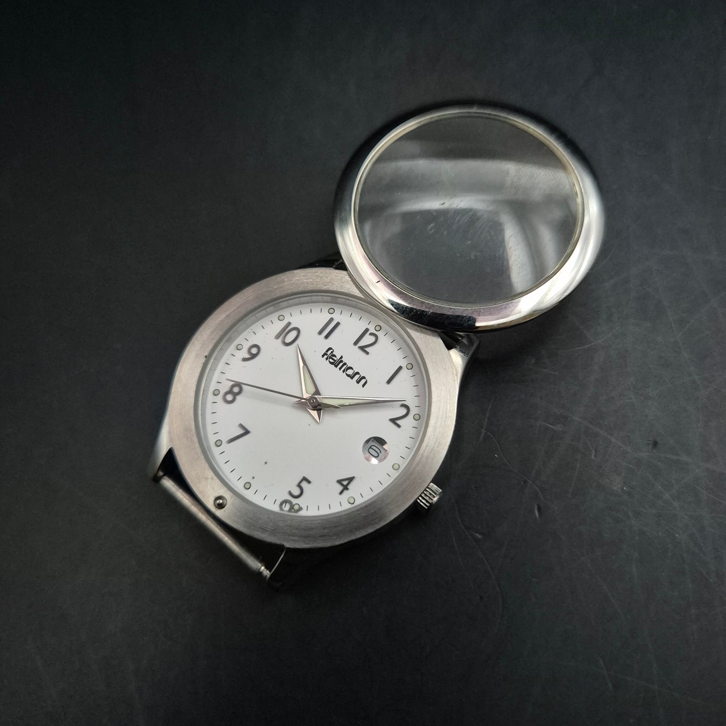 Fielmann Uhr – Edelstahl mit Klappglas & Datumsanzeige