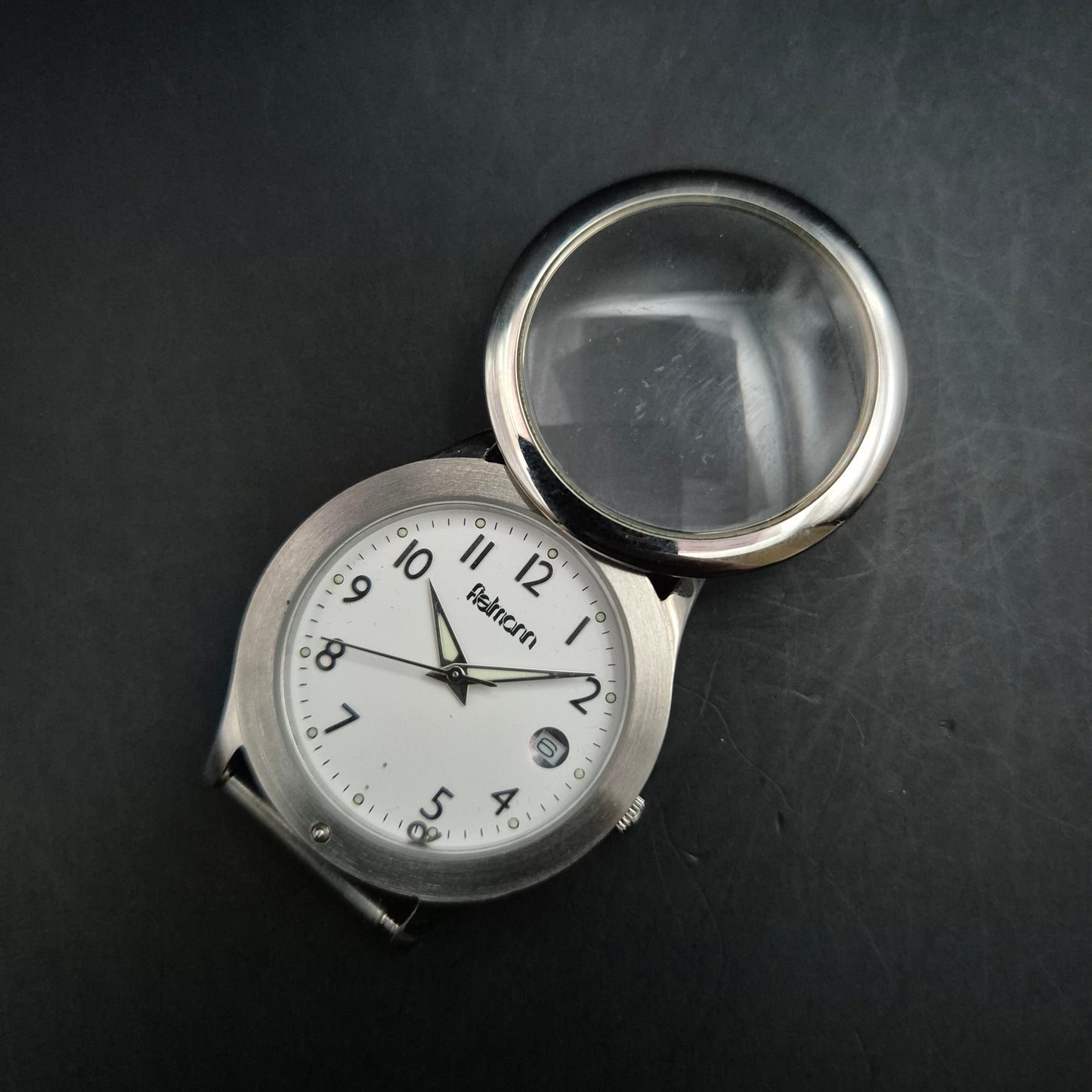 Fielmann Uhr – Edelstahl mit Klappglas & Datumsanzeige