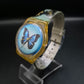 Swatch Damen Uhr mit Schmetterlingsmotiv – Buntes 90er Design