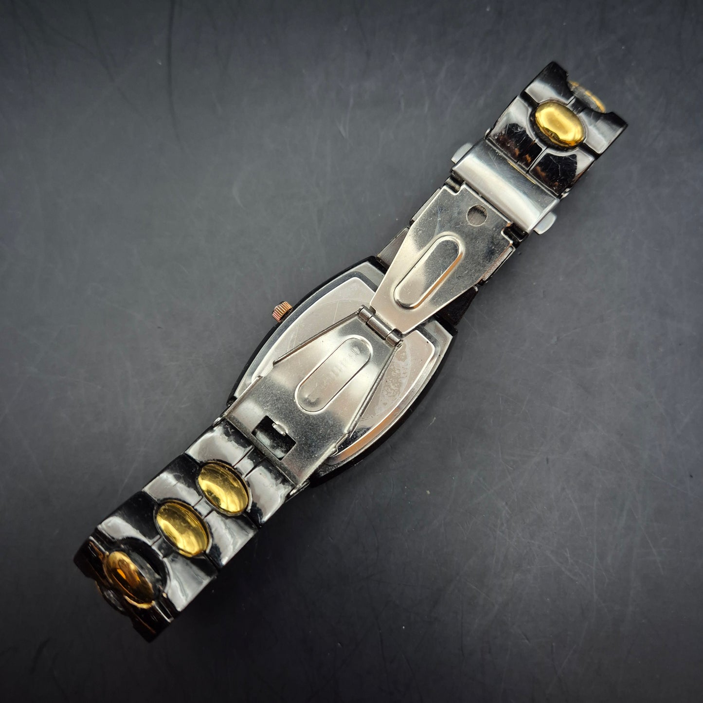 FLR Damen Uhr – Extravagantes Schwarz-Gold Bicolor Quarz