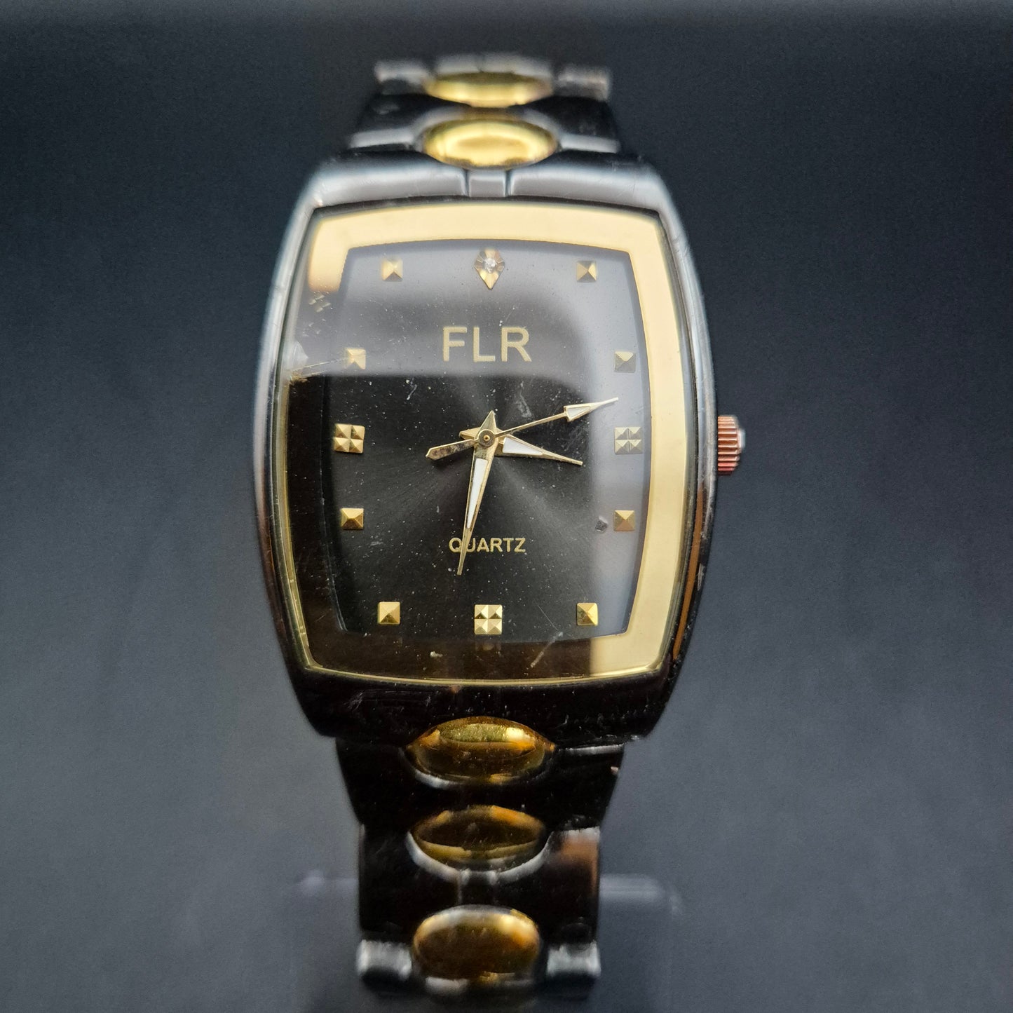 FLR Damen Uhr – Extravagantes Schwarz-Gold Bicolor Quarz