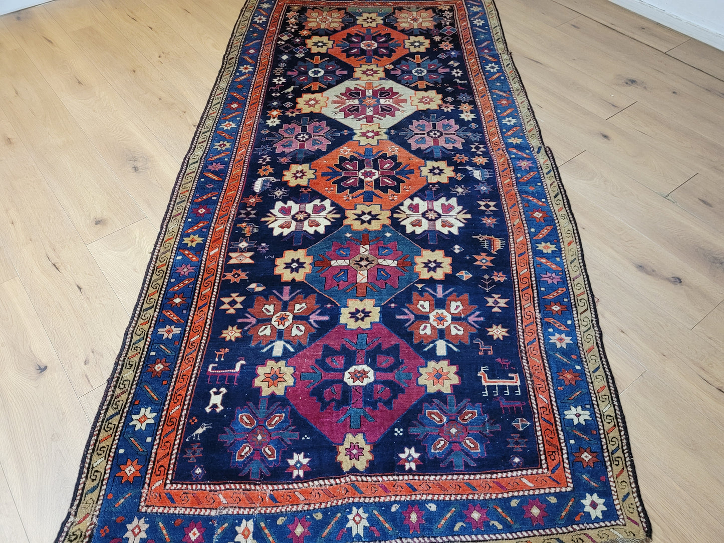 Orientteppich handgeknüpft Kazak antik 264x130 cm