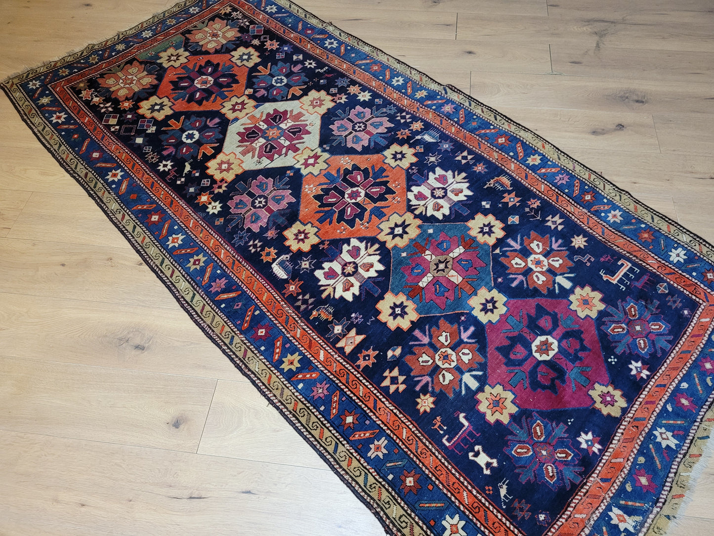 Orientteppich handgeknüpft Kazak antik 264x130 cm