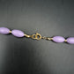 Charmante Damen Kette – Fliederfarbene Oval-Perlen mit Gold-Akzenten