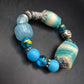 Auffälliges Damen Armband – Türkis-Mix mit Textil und Metall-Akzenten