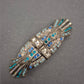 Art-Déco Brosche mit blauen Strasssteinen im Vintage-Stil