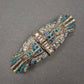 Art-Déco Brosche mit blauen Strasssteinen im Vintage-Stil