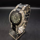 Elegante Damen Uhr mit schwarzem Zifferblatt und Strassbesatz