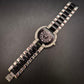 Elegante Damen Uhr mit schwarzem Zifferblatt und Strassbesatz
