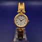 Elegante Cathay Damen Uhr – Goldfarbenes Armreif-Design mit römischen Ziffern