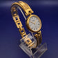 Elegante Cathay Damen Uhr – Goldfarbenes Armreif-Design mit römischen Ziffern