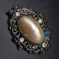 Elegante Vintage Brosche – Kunstvolles Design mit bunten Steinen