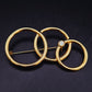 Elegante Brosche mit ineinandergreifenden Ringen – Goldfarbenes Vintage Design