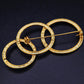 Elegante Brosche mit ineinandergreifenden Ringen – Goldfarbenes Vintage Design