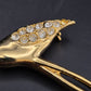 Elegante Flamingo Brosche in Gold-Optik mit funkelnden Steinen