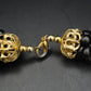 Elegante Schwarze Perlen Kette – Gedrehtes Design mit Goldakzenten