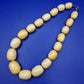 Auffällige Vintage Statement-Kette mit großen Perlen in Bernsteinoptik