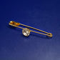 Elegante goldfarbene Brosche – Sicherheitsnadel mit funkelndem Kristall
