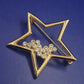 Funkelnde Goldfarbene Stern Brosche mit Strassbesatz