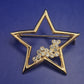 Funkelnde Goldfarbene Stern Brosche mit Strassbesatz