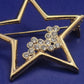 Funkelnde Goldfarbene Stern Brosche mit Strassbesatz