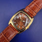 Stilvolle MC Herren Uhr – Elegantes Tonneau-Design in Braun & Gold