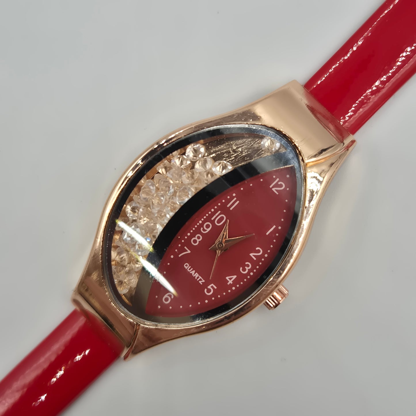 Moderne Damen Uhr mit beweglichen Steinen – Rotes Design