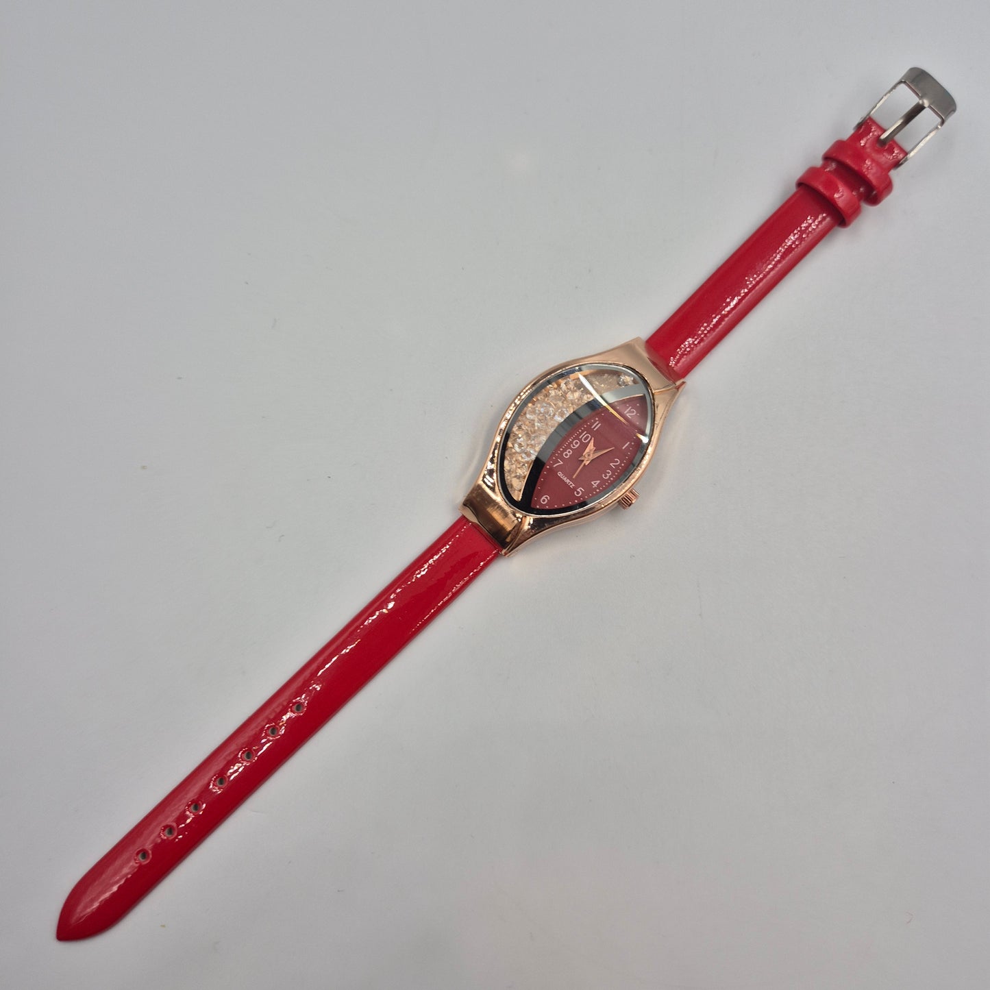 Moderne Damen Uhr mit beweglichen Steinen – Rotes Design