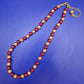 Elegante Damen Perlen Kette in Rot und Gold – Stilvolles Design