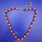 Elegante Damen Perlen Kette in Rot und Gold – Stilvolles Design