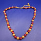 Elegante Damen Perlen Kette in Rot und Gold – Stilvolles Design
