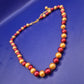Elegante Damen Perlen Kette in Rot und Gold – Stilvolles Design