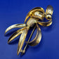 Elegante Vintage Brosche Goldfarben Wellen Design