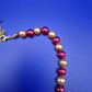 Elegante Vintage Perlenkette in Weinrot und Creme mit Goldton