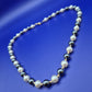 Elegante Perlenkette mit grauen und weißen Perlen