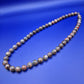 Elegante Vintage Kette aus gemusterten Natursteinperlen