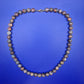 Elegante Vintage Kette aus gemusterten Natursteinperlen