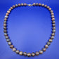 Elegante Vintage Kette aus gemusterten Natursteinperlen