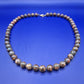 Elegante Vintage Kette aus gemusterten Natursteinperlen
