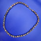 Elegante Vintage Kette aus gemusterten Natursteinperlen