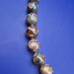 Elegante Vintage Kette aus gemusterten Natursteinperlen
