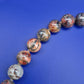 Elegante Vintage Kette aus gemusterten Natursteinperlen