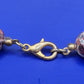 Elegante Vintage Kette aus gemusterten Natursteinperlen
